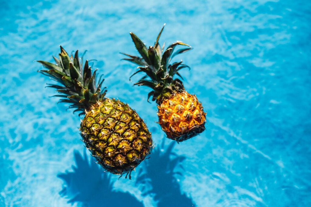 Pineapple in a swimming pool Stock Free