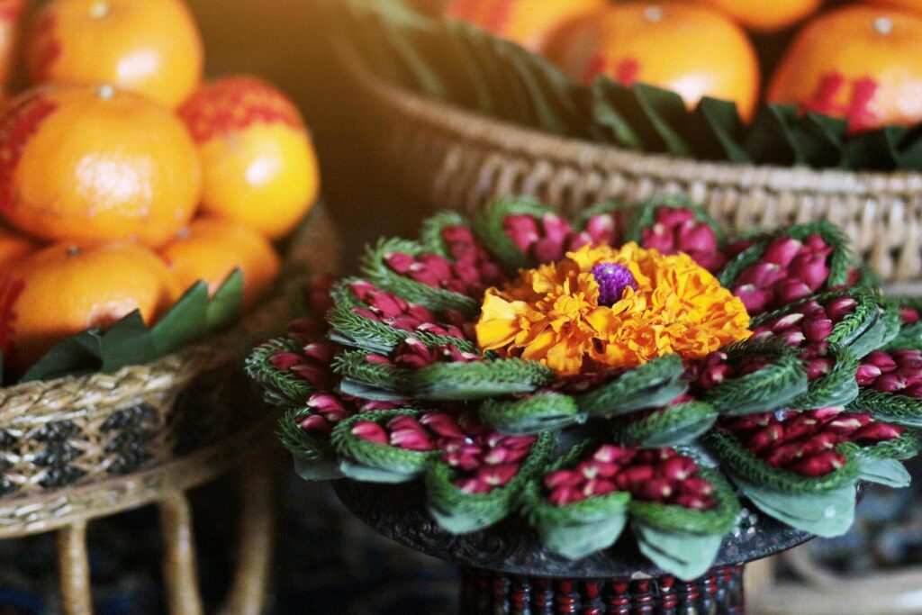 Marigold and rose Flowers in vase made of banana leaf in Traditional Thai Art Decorated Craft Pattern in wedding ceremony traditional. Stock Free