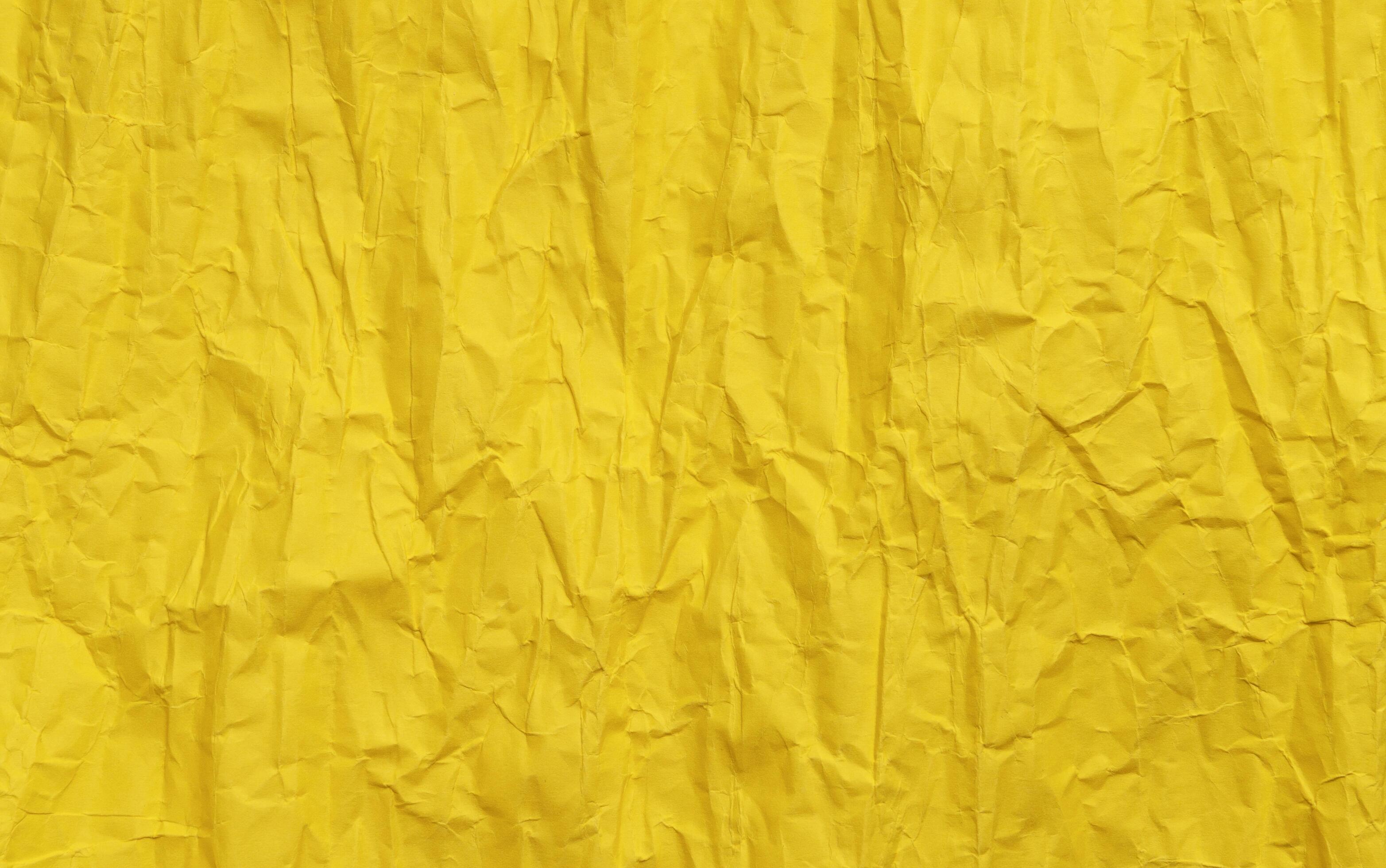 Yellow crumpled paper texture, grunge background Stock Free