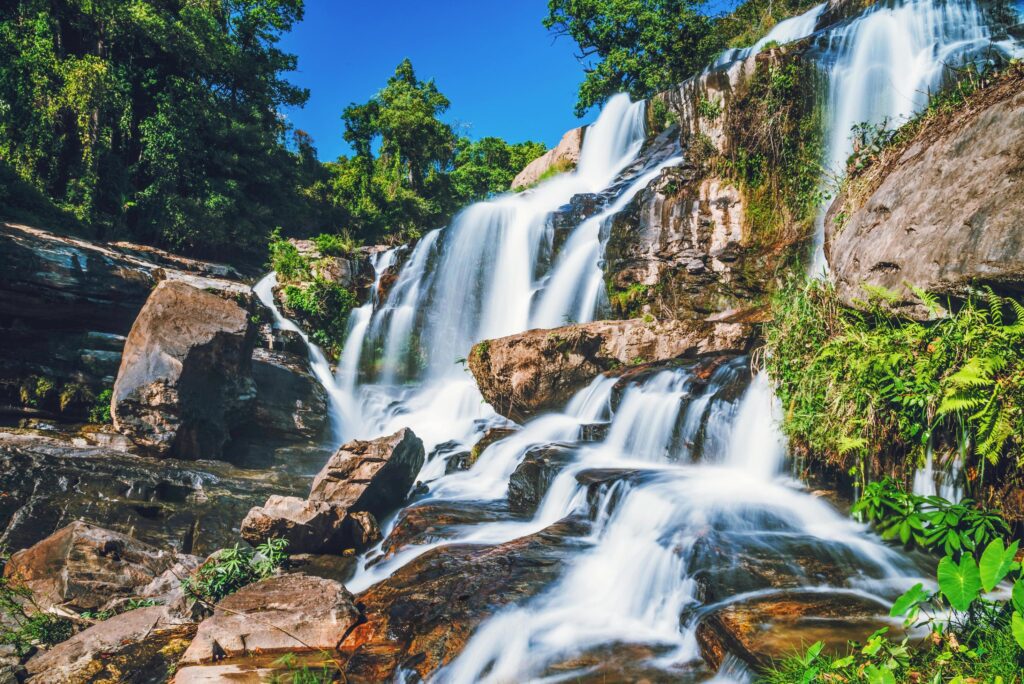 Natural background waterfall. travel nature. Travel relax waterfall. In the summer. thailand Stock Free