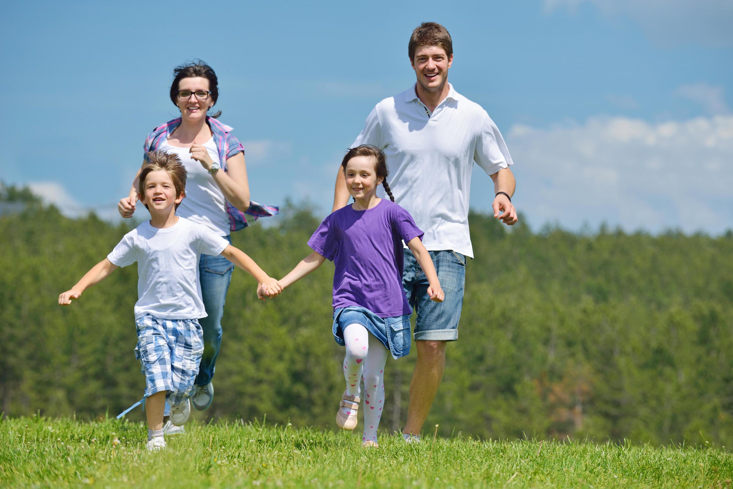 happy young family have fun outdoors Stock Free