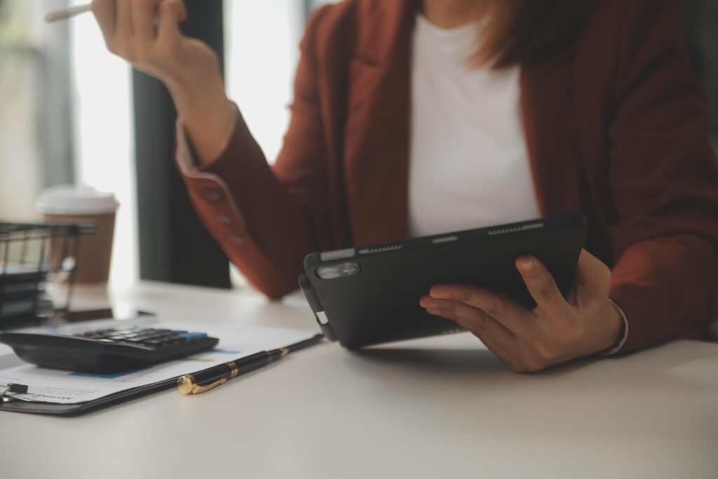 Shot of a asian young business Female working on laptop in her workstation. Stock Free