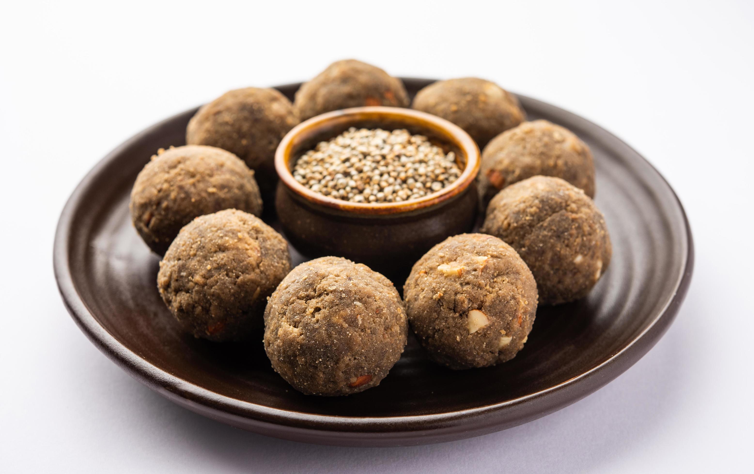 Bajra Atta Ladoo or kuler laddoo – Millet Flour Laddu, a popular winter sweet snack food from India Stock Free