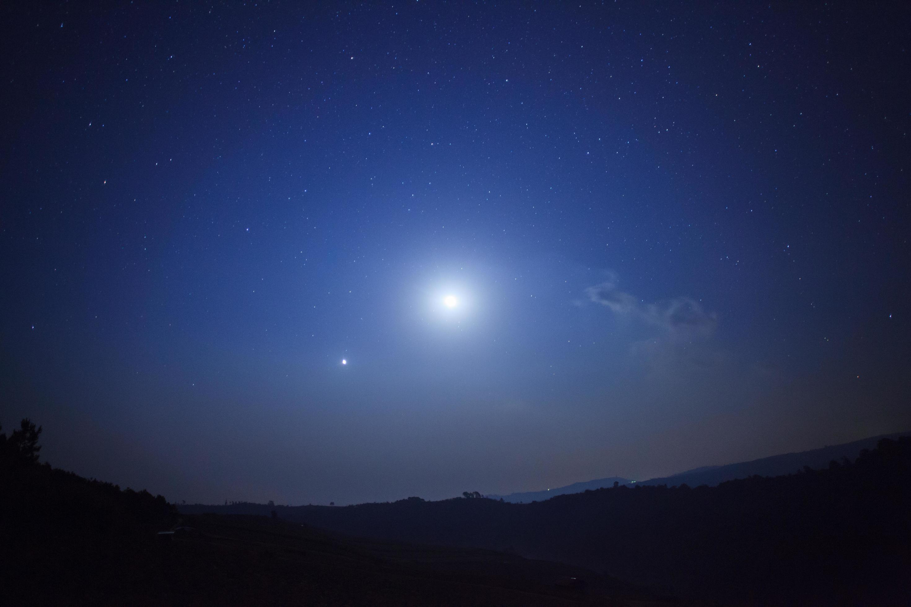 Night nature background, cloudy sky with stars and moon light Stock Free