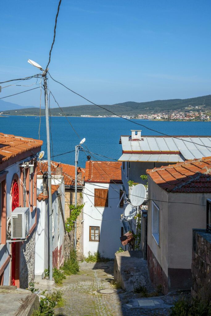 Narrow streets in a Turkish city on a summer and sunny day with old and masonry wooden houses. Stock Free