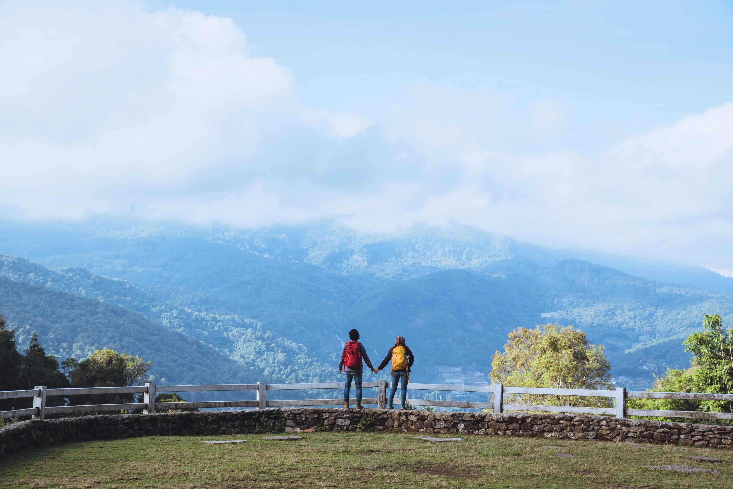 Couples travel nature at sheep farm at Doi Pha Tang, Doi Inthanon National Park, Chom Thong, Chiang Mai, Thailand Stock Free