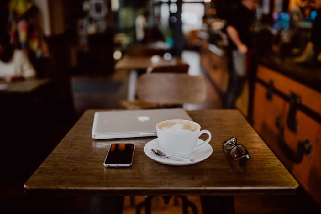 Cup of coffee on table in cafe Stock Free