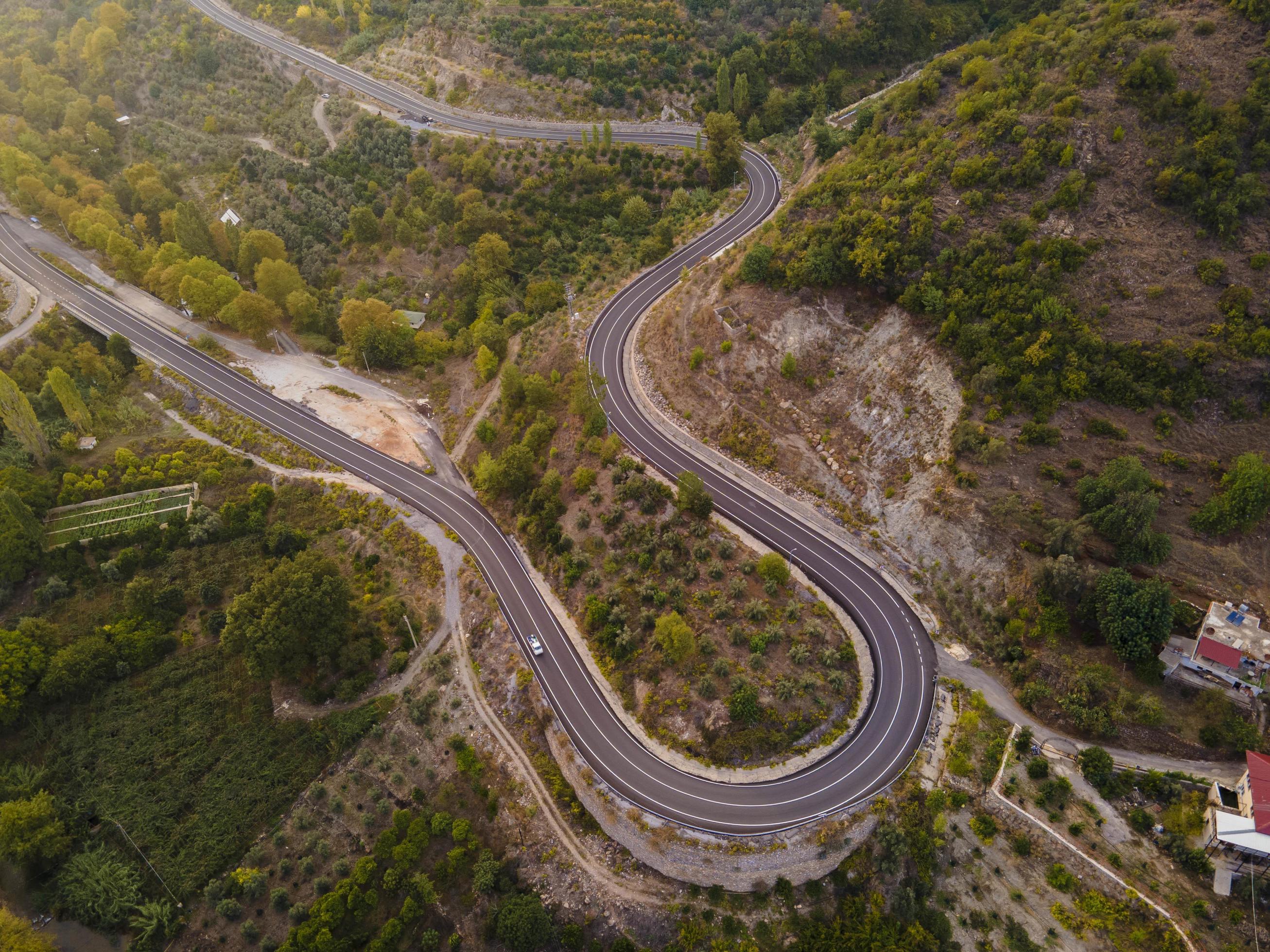 aerial valley and road, Top view, amazing nature background. sunset Flying drone, seascape Stock Free