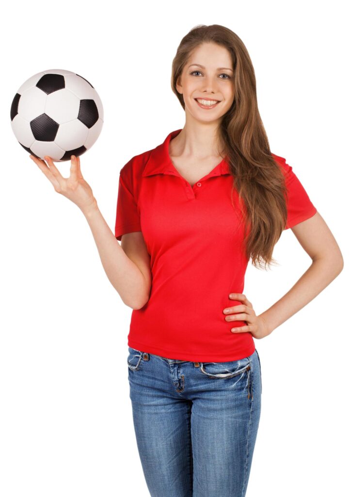 Pretty girl with a soccer ball Stock Free