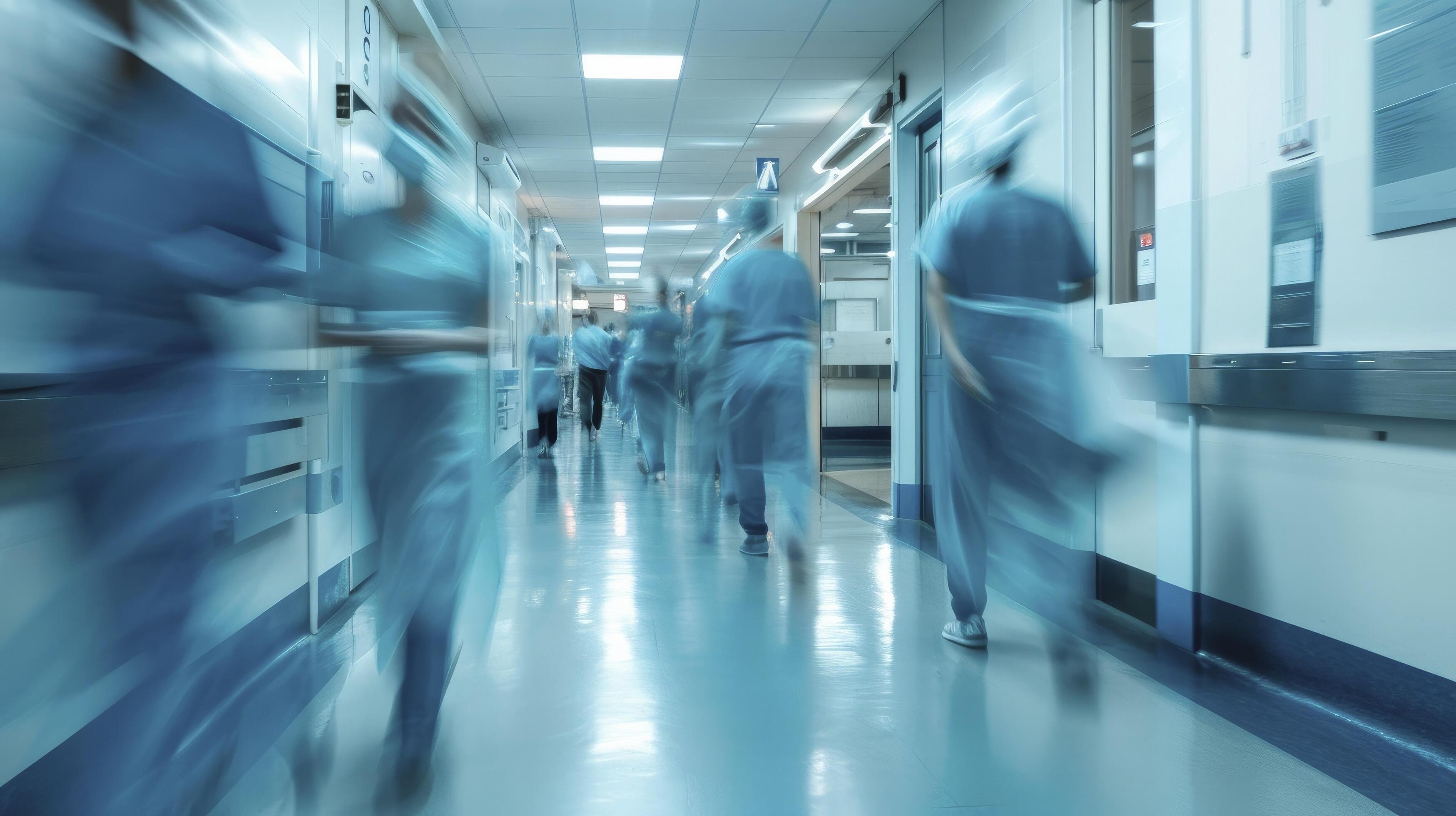 AI generated Long exposure blurred motion of medical doctors and nurses in a hospital ward wearing blue aprons, walking down a corridor Stock Free