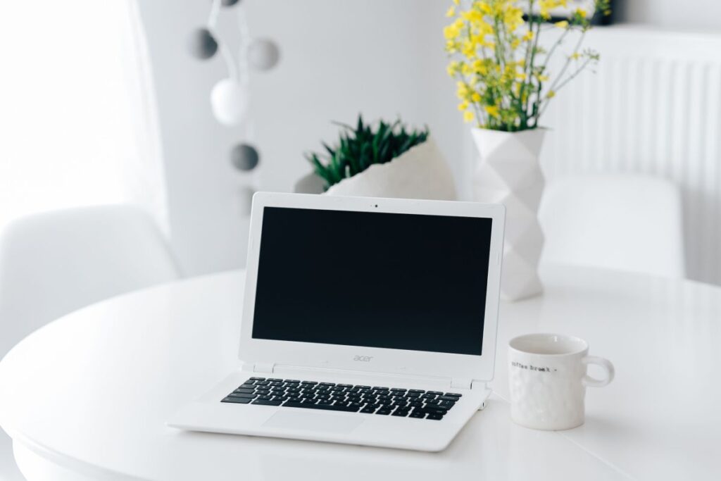 Workplace with laptop on table at home Stock Free