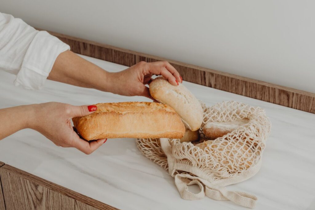 Fresh bread on the kitchen counter – ciabatta – baguette Stock Free