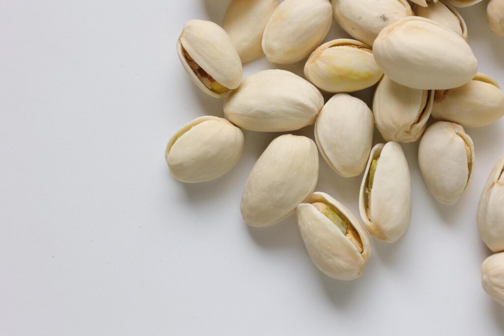 Pistachios nuts seeds on white background Stock Free