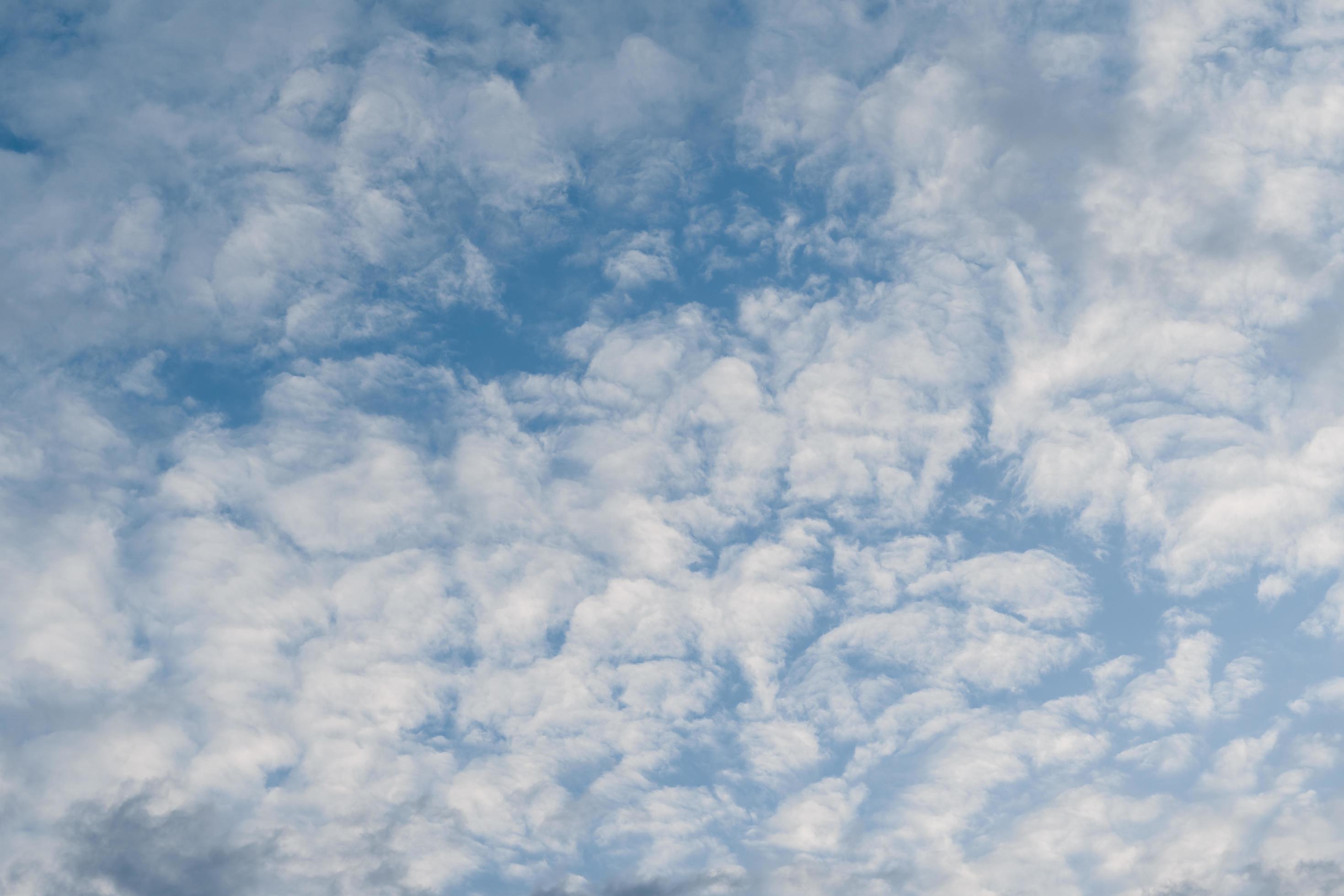 Blue sky with white fluffy cloud using as nature wallpaper or background. Stock Free