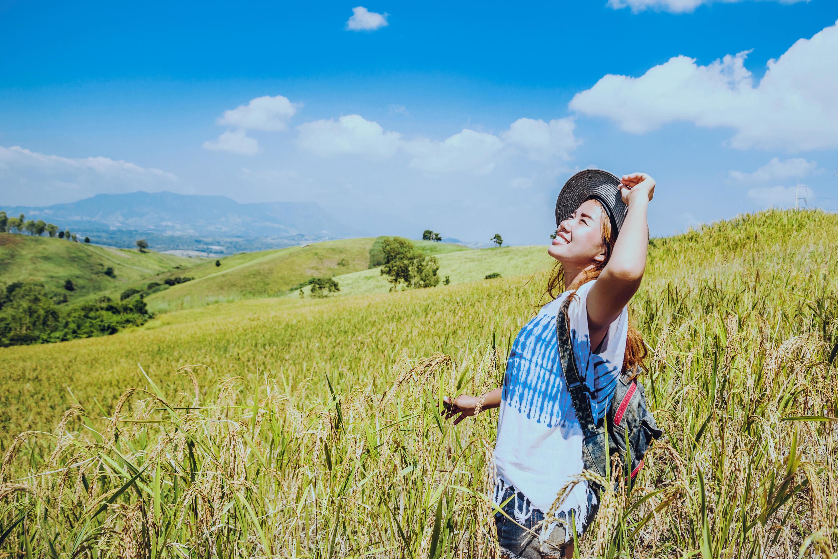 Asian women travel relax in the holiday. Stand natural touch mountain field. Thailand Stock Free