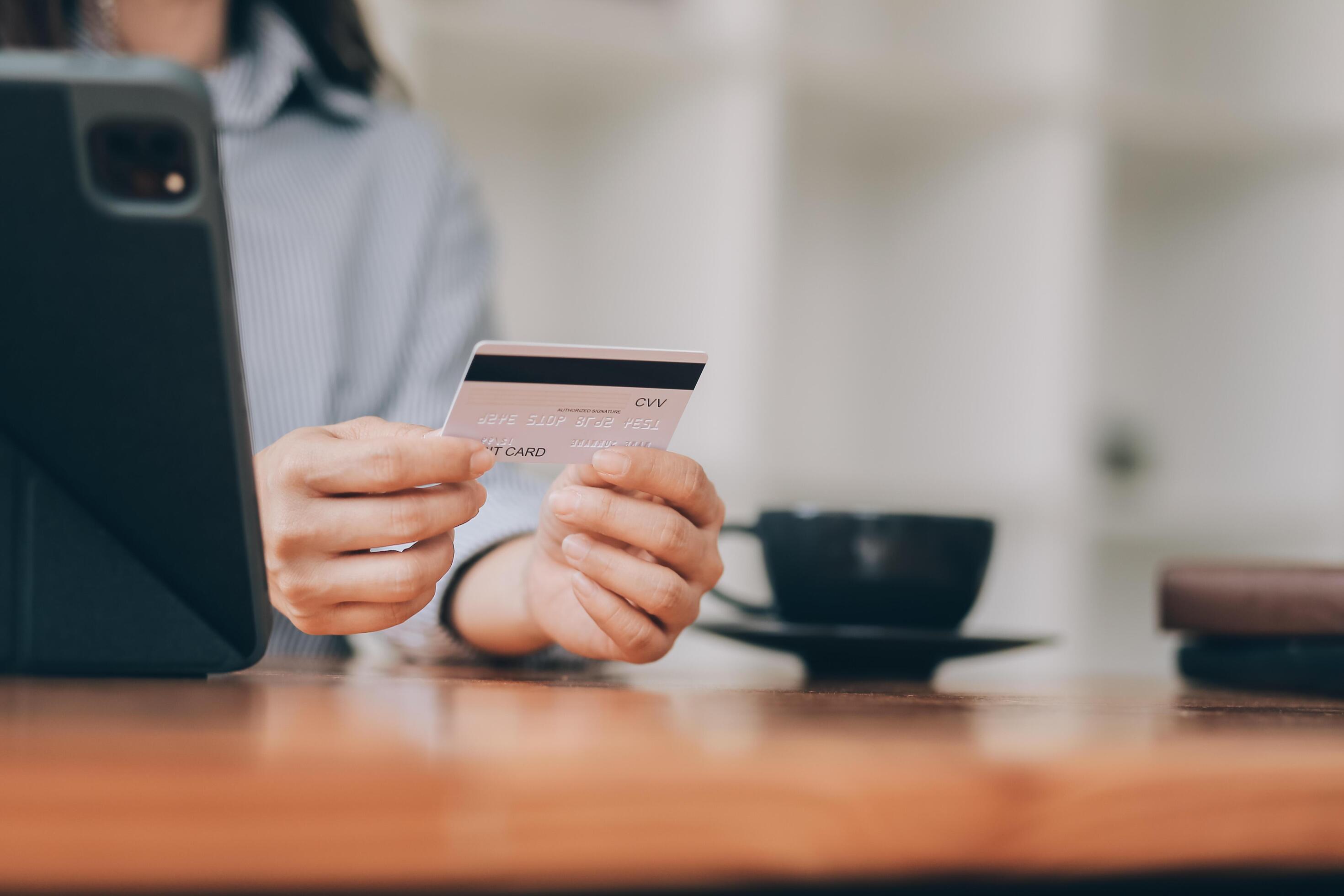 Happy asian woman using smartphone shopping online with credit card. Lifestyle. Easy pay using smart phone or digital device. Stock Free