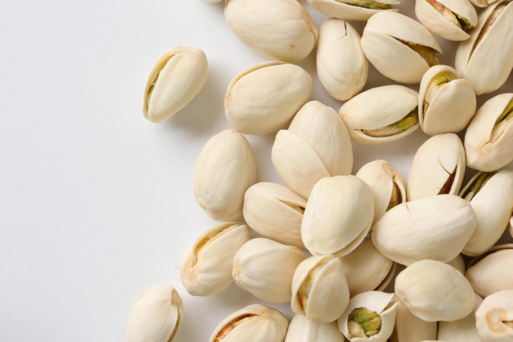 Pistachios nuts seeds on white background Stock Free