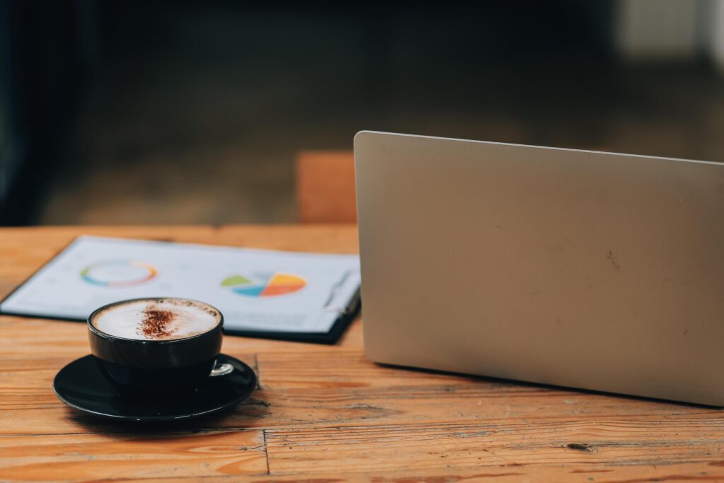 Closeup of coffee cup on table in empty corporate conference room before business meeting in office Stock Free