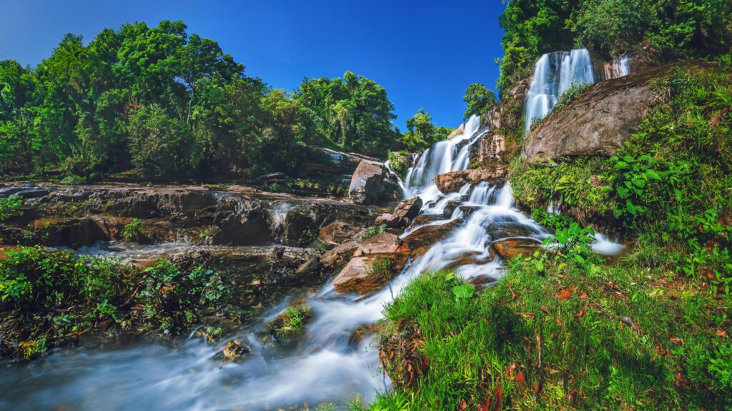 Natural background waterfall. travel nature. Travel relax waterfall. In the summer. thailand Stock Free