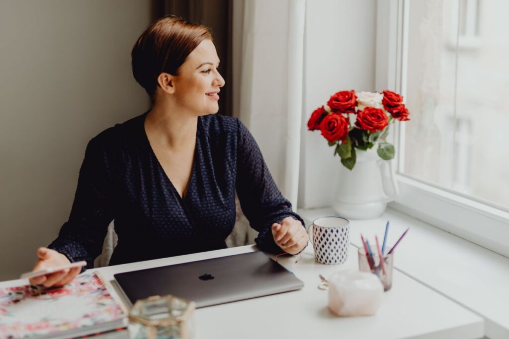 Happy casual beautiful woman working on a laptop Stock Free