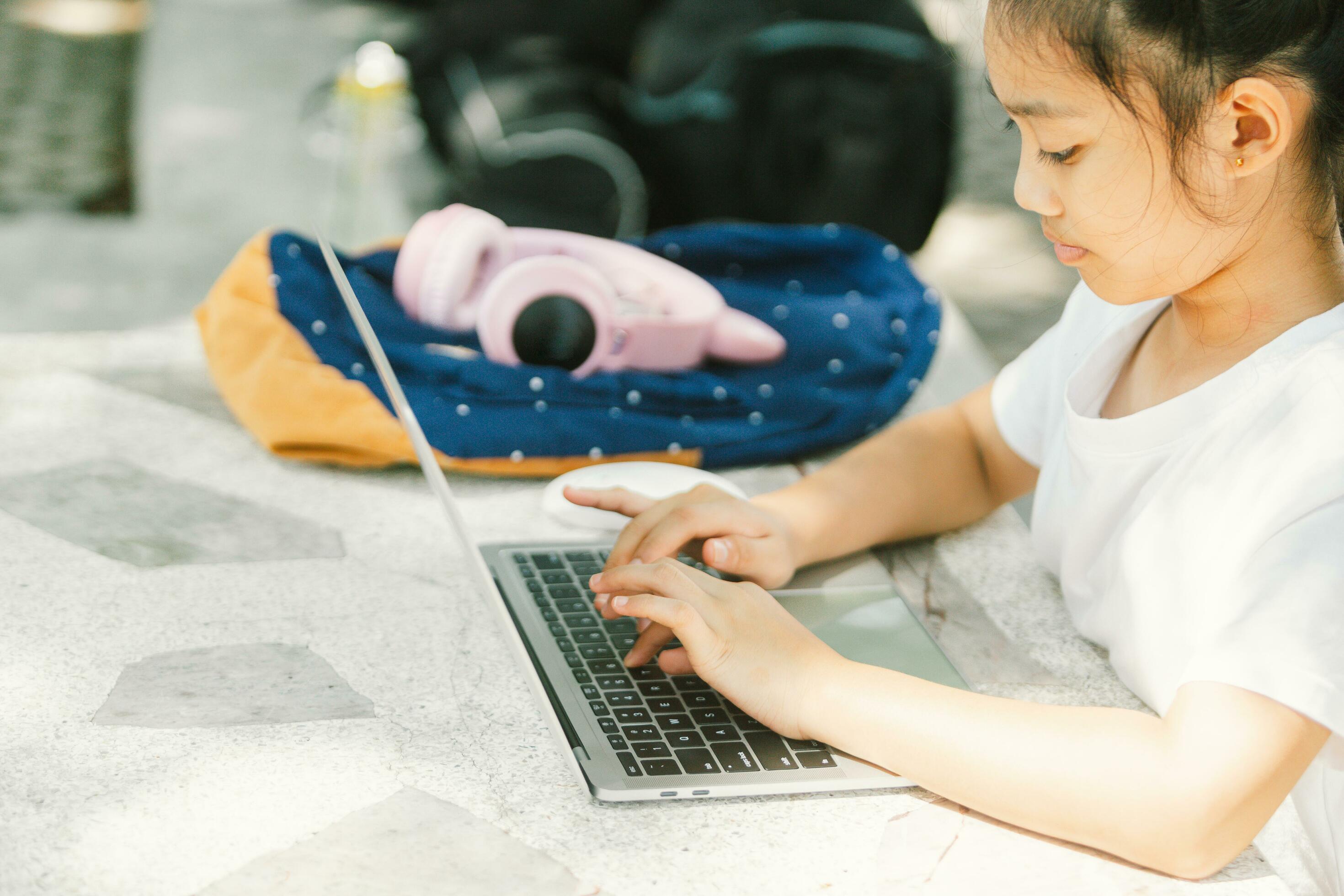 Young asian woman using laptop on the street. Lifestyle concept. Stock Free