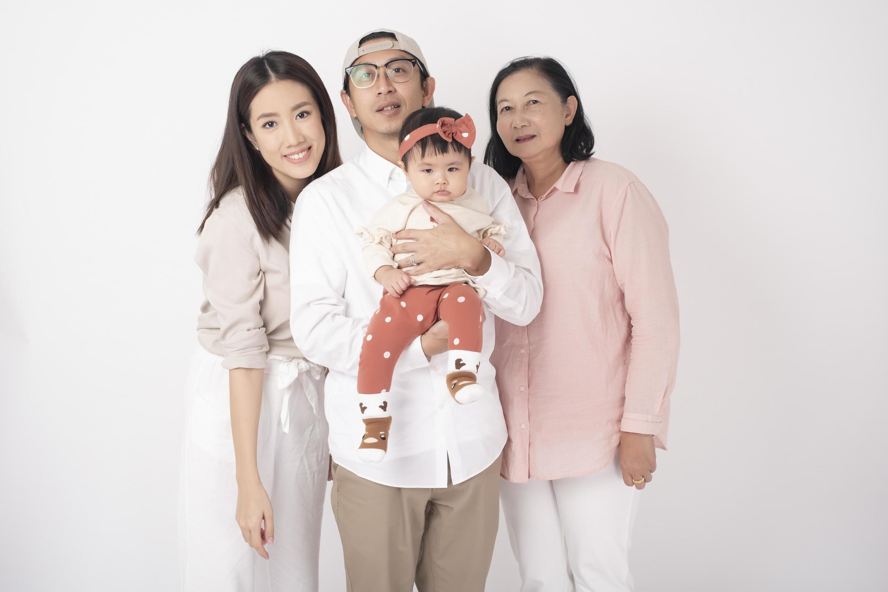 Happy Asian family on white background Stock Free