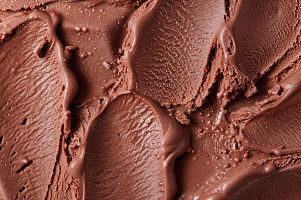 Top view of chocolate ice cream surface. Summer delicious dessert, taste of happiness, ice cream business. Background with place for text. Stock Free