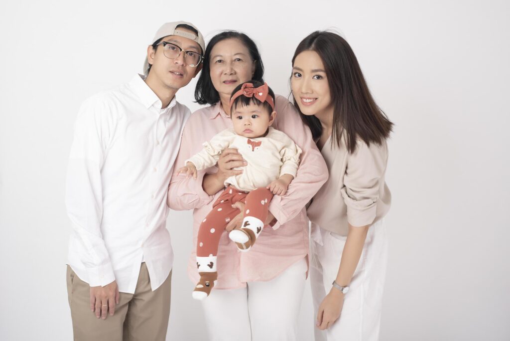 Happy Asian family on white background Stock Free