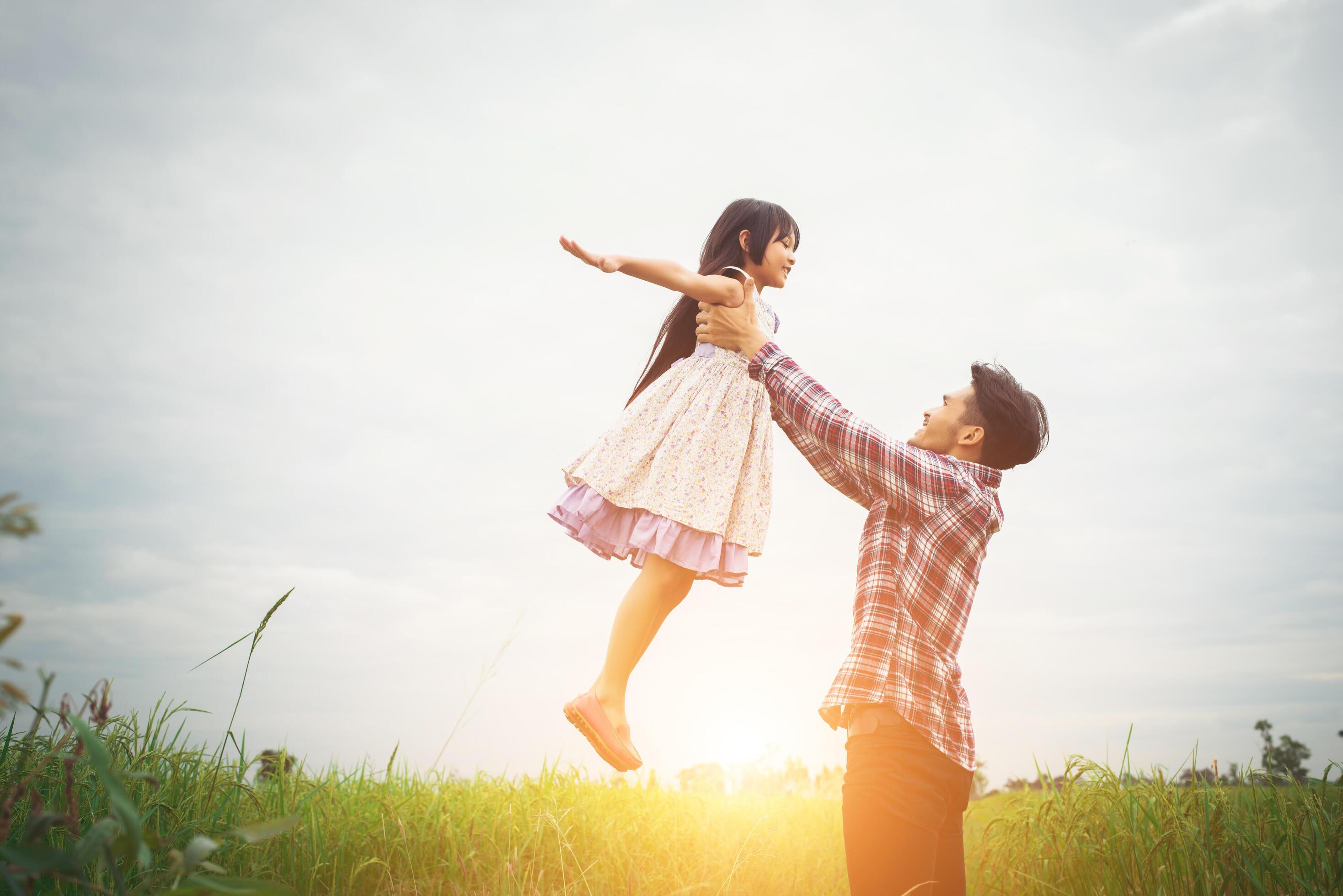 Daddy carrying his daughter with nature and sunlight, enjoyment family. Stock Free