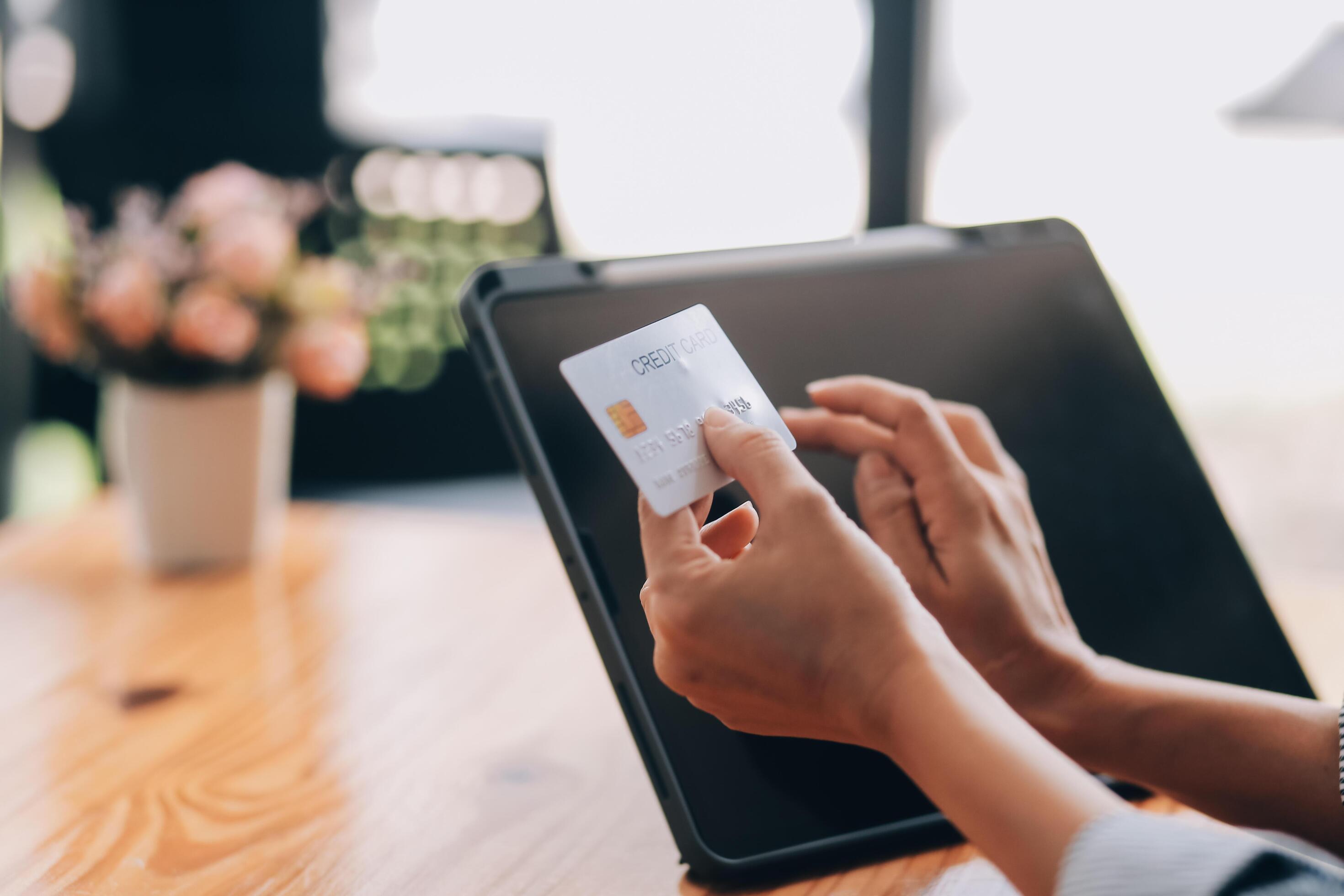 Happy asian woman using smartphone shopping online with credit card. Lifestyle. Easy pay using smart phone or digital device. Stock Free