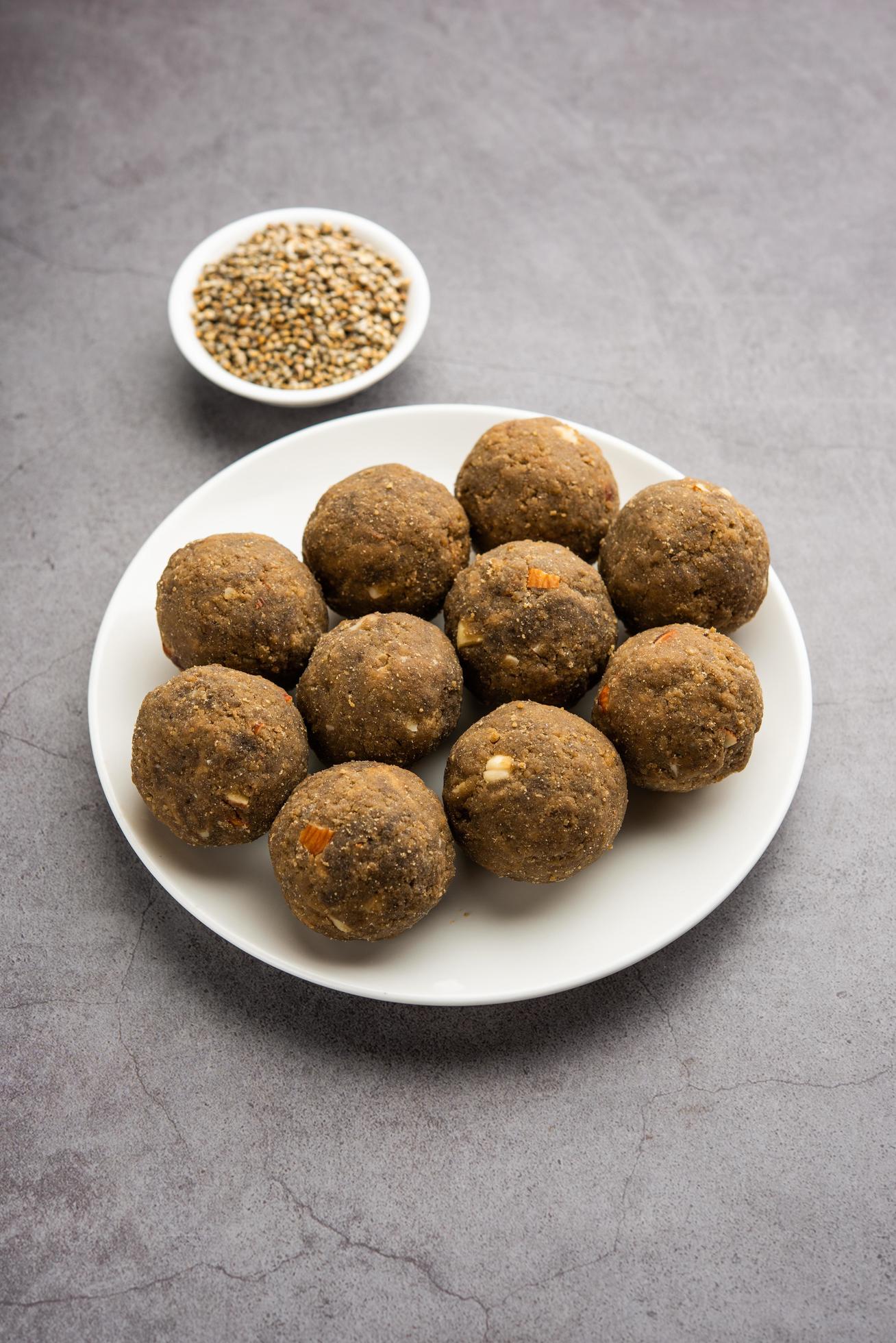 Bajra Atta Ladoo or kuler laddoo – Millet Flour Laddu, a popular winter sweet snack food from India Stock Free