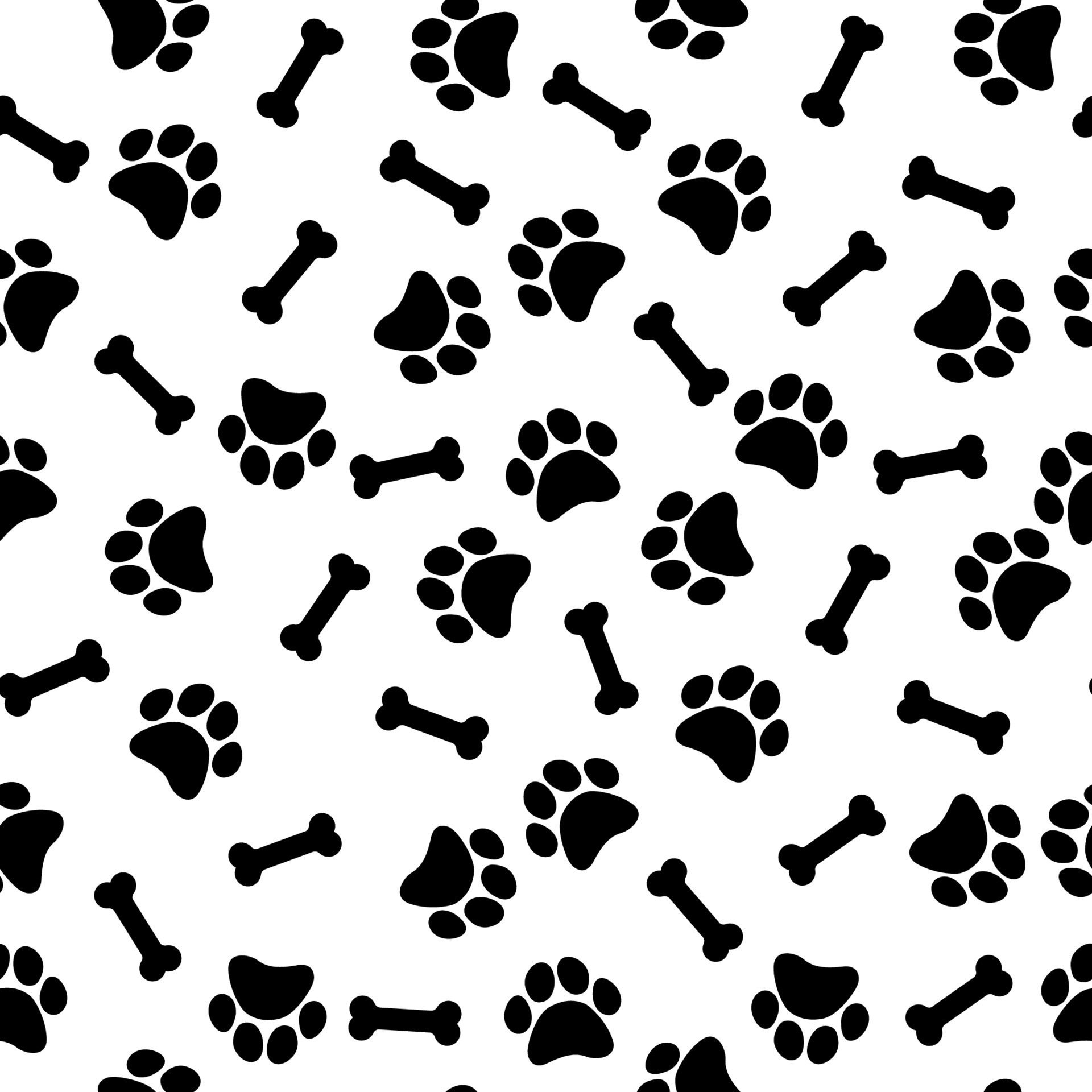 Seamless pattern with bones and paw prints of animals Free Vector