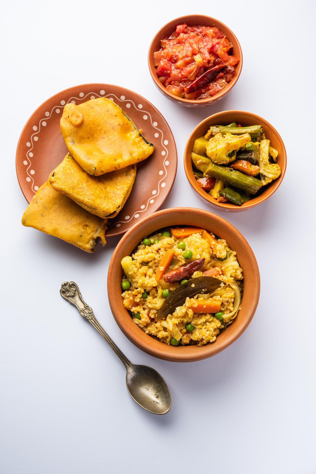 Bengali Bhog food for Indian Hindu Durga Puja or pooja festival. Khichadi, labra, tomato chutney Stock Free