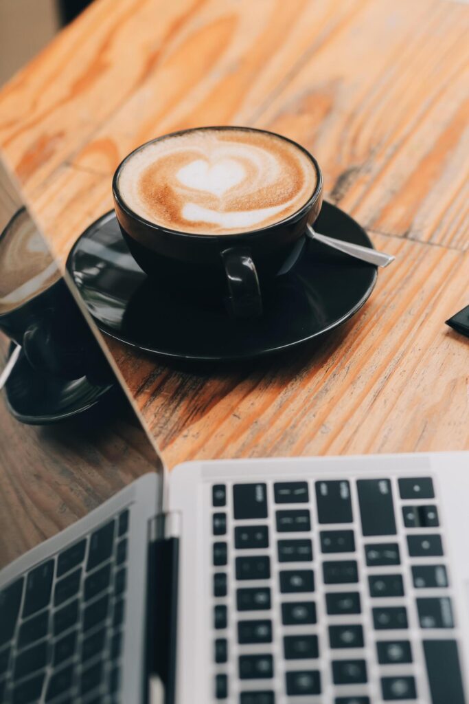 Closeup of coffee cup on table in empty corporate conference room before business meeting in office Stock Free