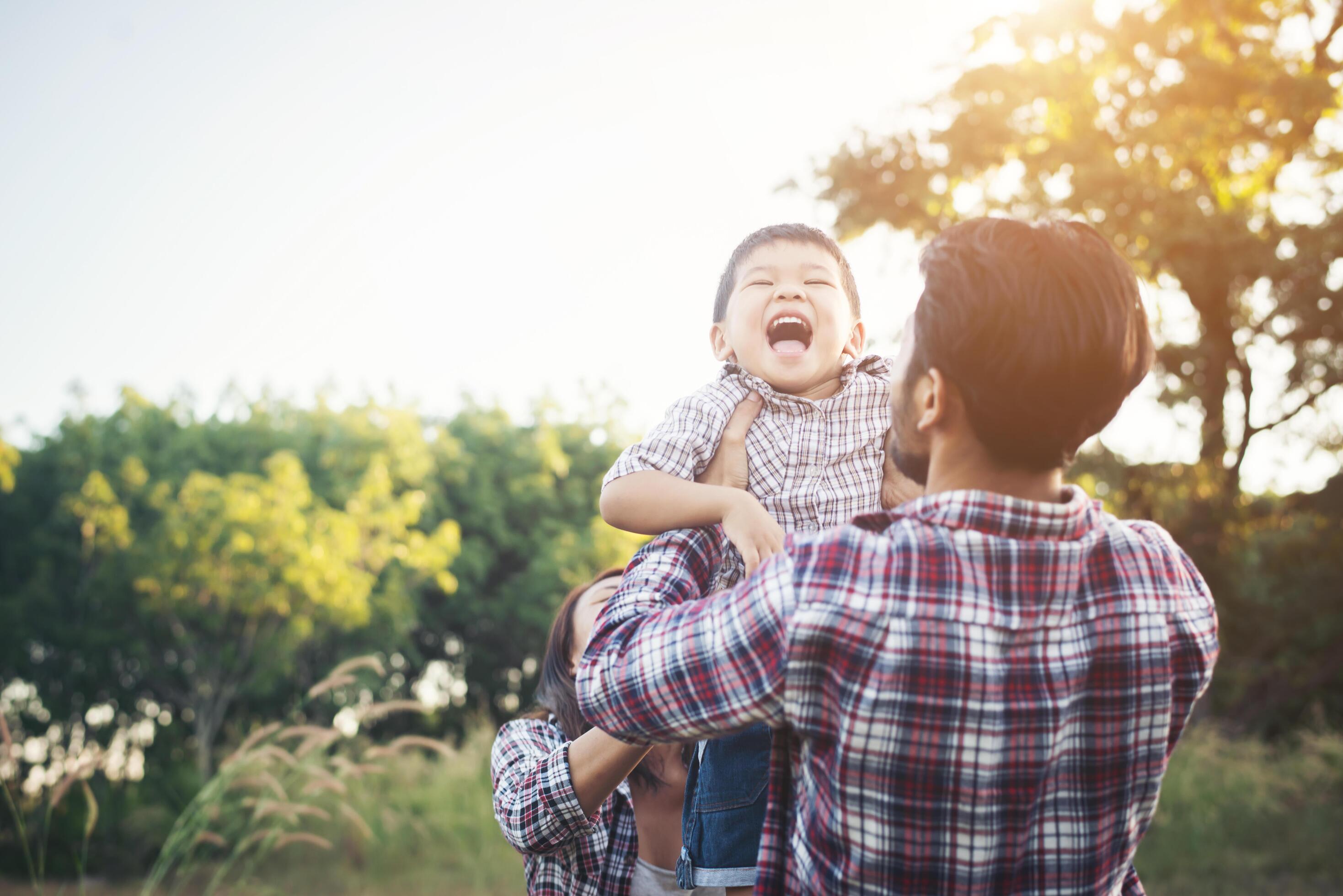 Happy young family spending time together outside. Family love concept Stock Free