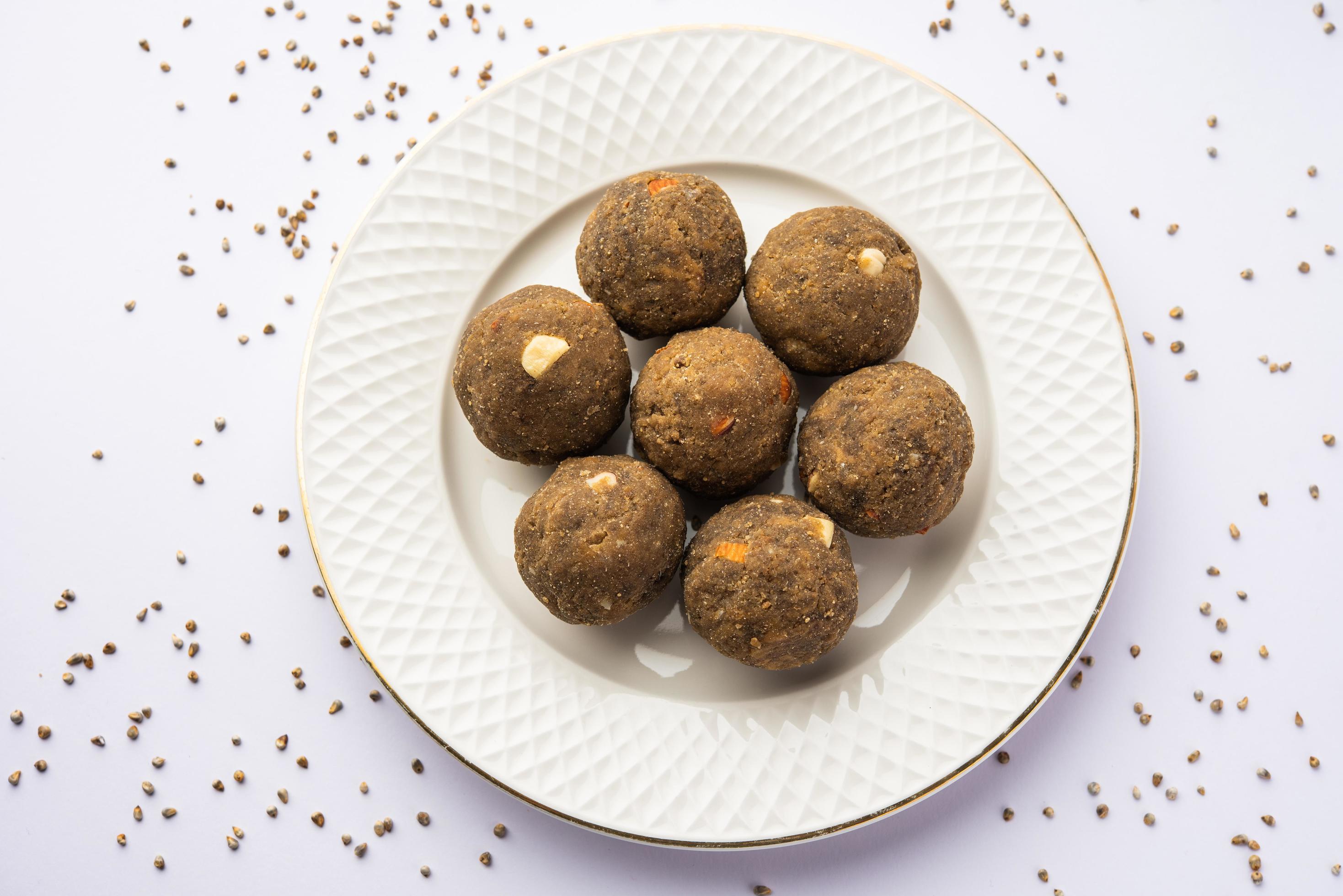 Bajra Atta Ladoo or kuler laddoo – Millet Flour Laddu, a popular winter sweet snack food from India Stock Free