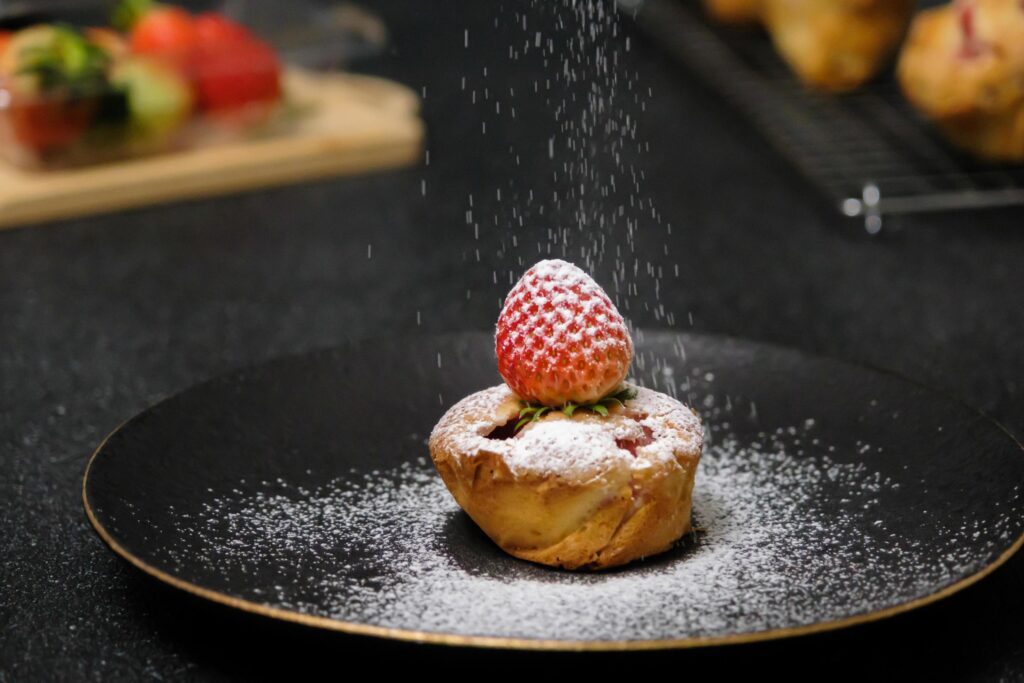 Homemade Strawberry cake topping with icing sugar. Sweet food. Sweet dessert. perfect summer season dessert served on plate. Stock Free