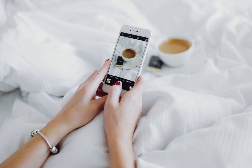 Morning coffee with chocolate in bed Stock Free