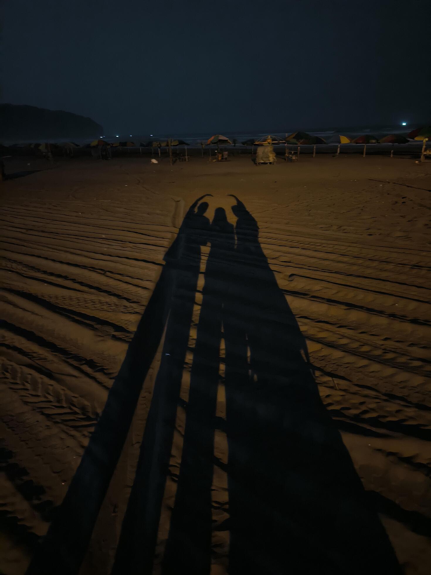 Shadow of my happy family, on the sand, at the night Stock Free