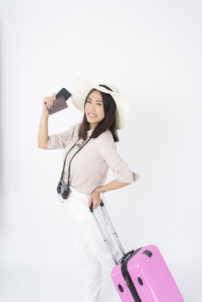 Beautiful Asian woman tourist on white background Stock Free