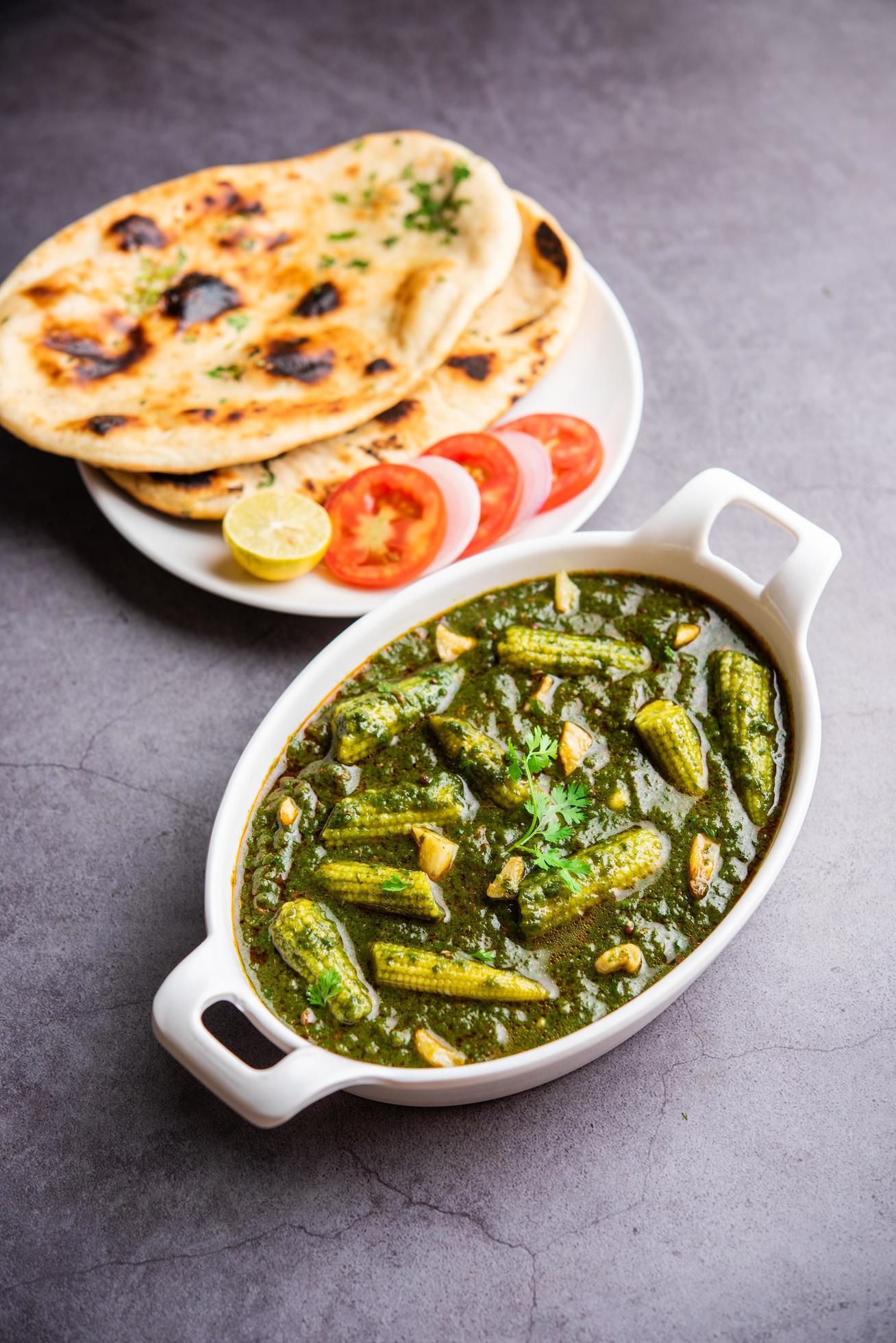 palak baby corn sabzi also known as spinach makai curry served with rice or roti, Indian food Stock Free