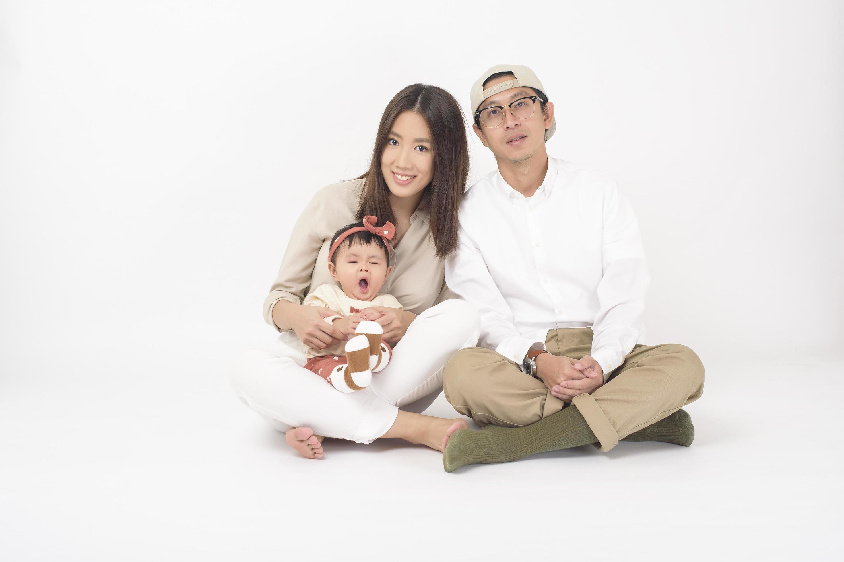 Happy Asian family on white background Stock Free