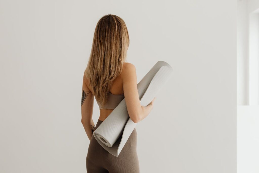 Young woman practicing yoga at home Stock Free