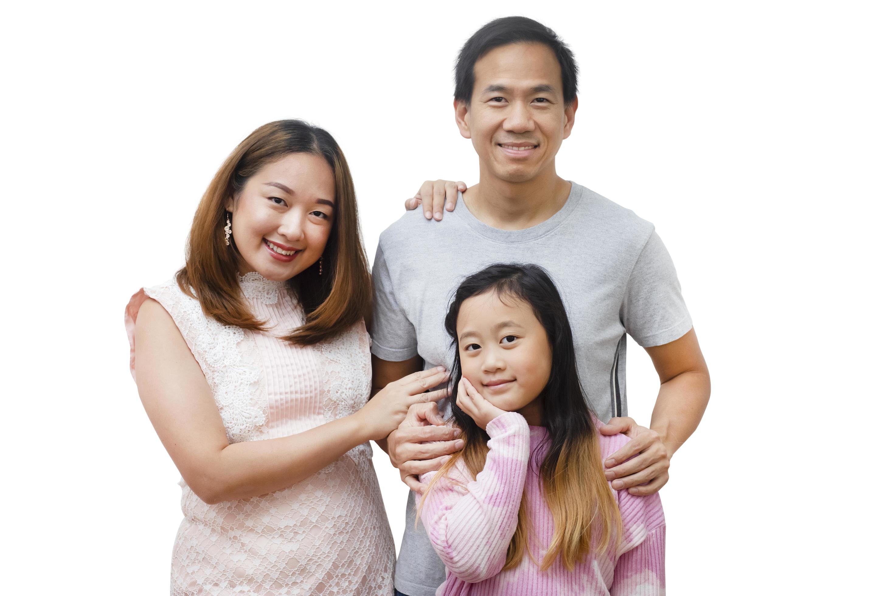 Asian family woman and a man with little junior woman smiling and fun isolated over white background Stock Free