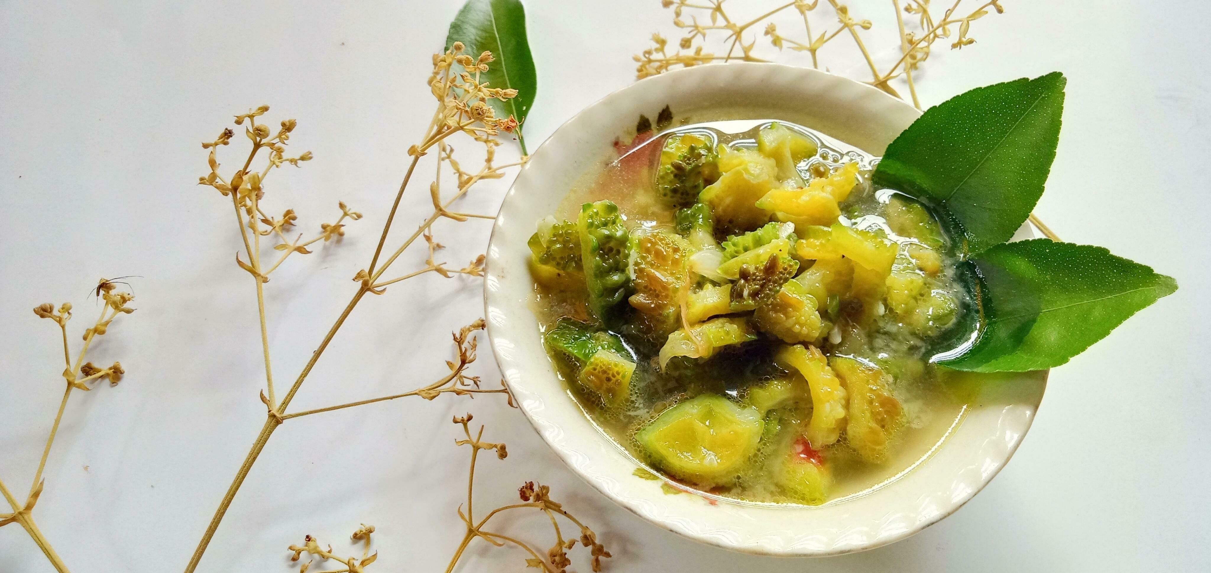 Anti diabetic food- bitter melon dish or tumis pare with on the white background Stock Free