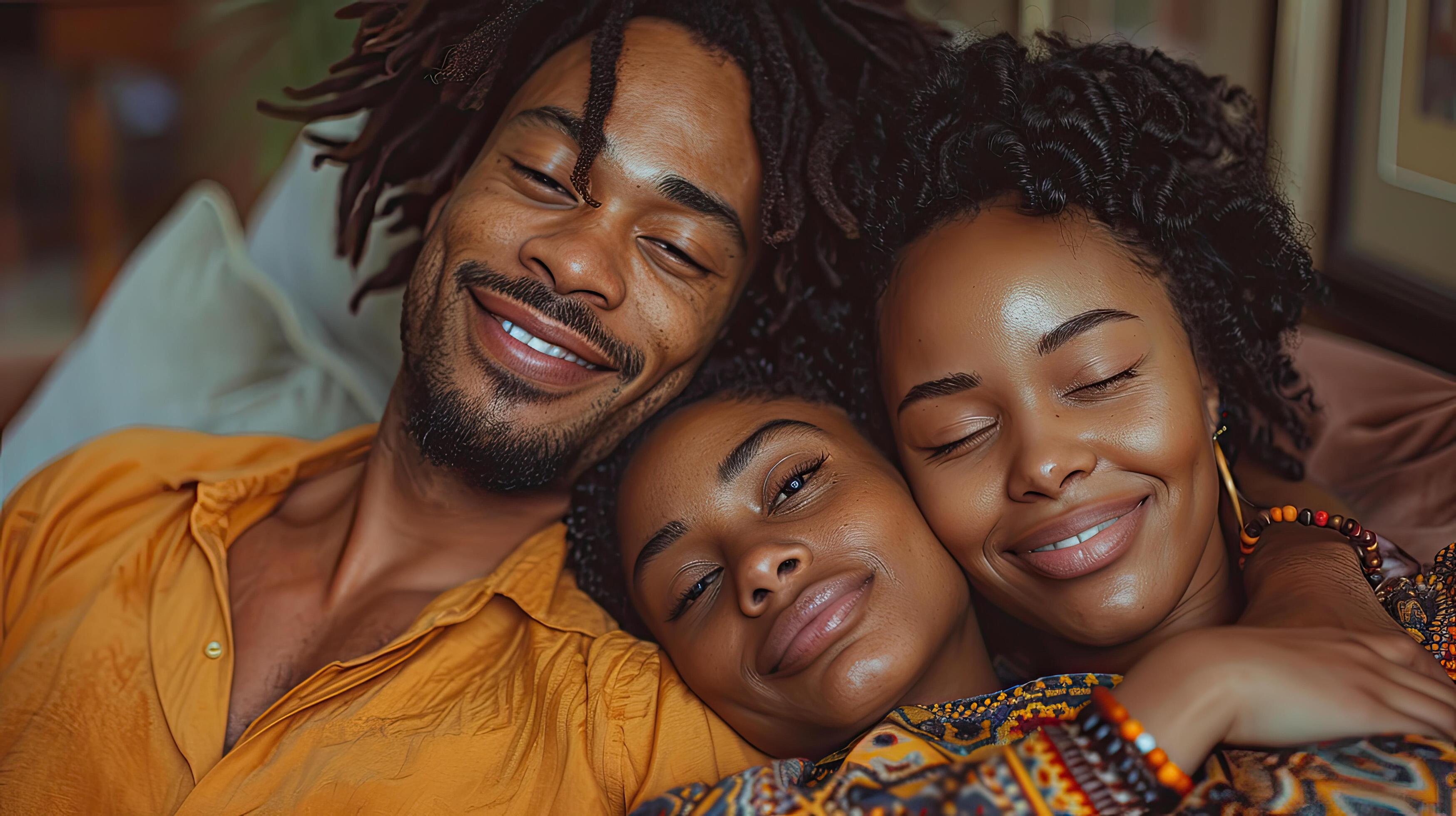 Young beautiful happy family relaxing at home Stock Free