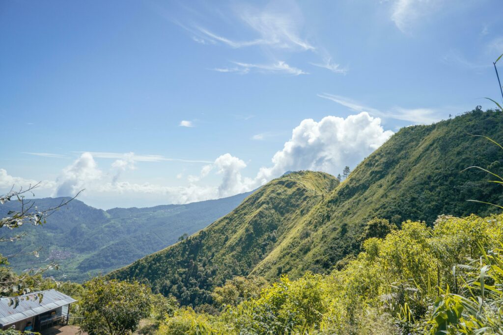 Landscape mountain when morning time sunlight summer vibes. The photo is suitable to use for adventure content media, nature poster and forest background. Stock Free