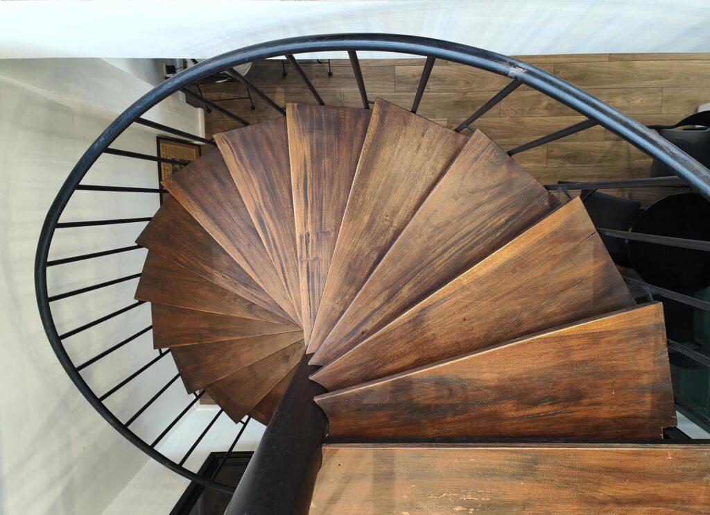 Top view of a wooden spiral staircase in a private house Stock Free