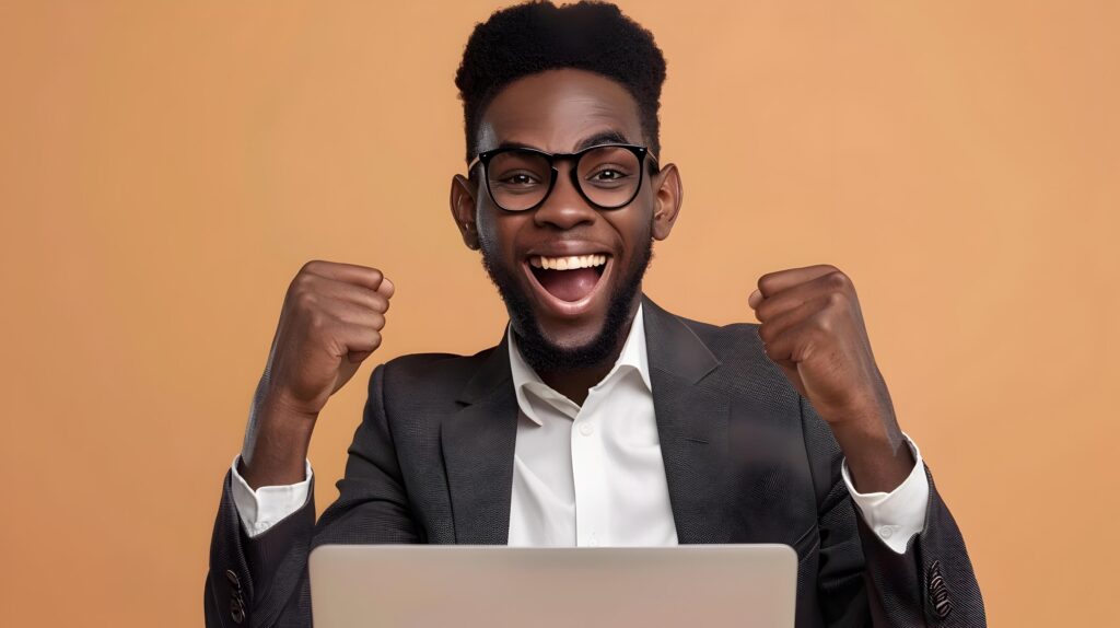 Enthusiastic Young Business Professional Celebrates Success at Work Stock Free