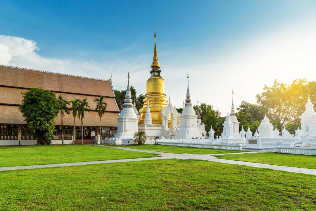 The golden pagoda at Wat Suan Dok, Chiangmai, Thailand, with beautiful blue sky. Stock Free